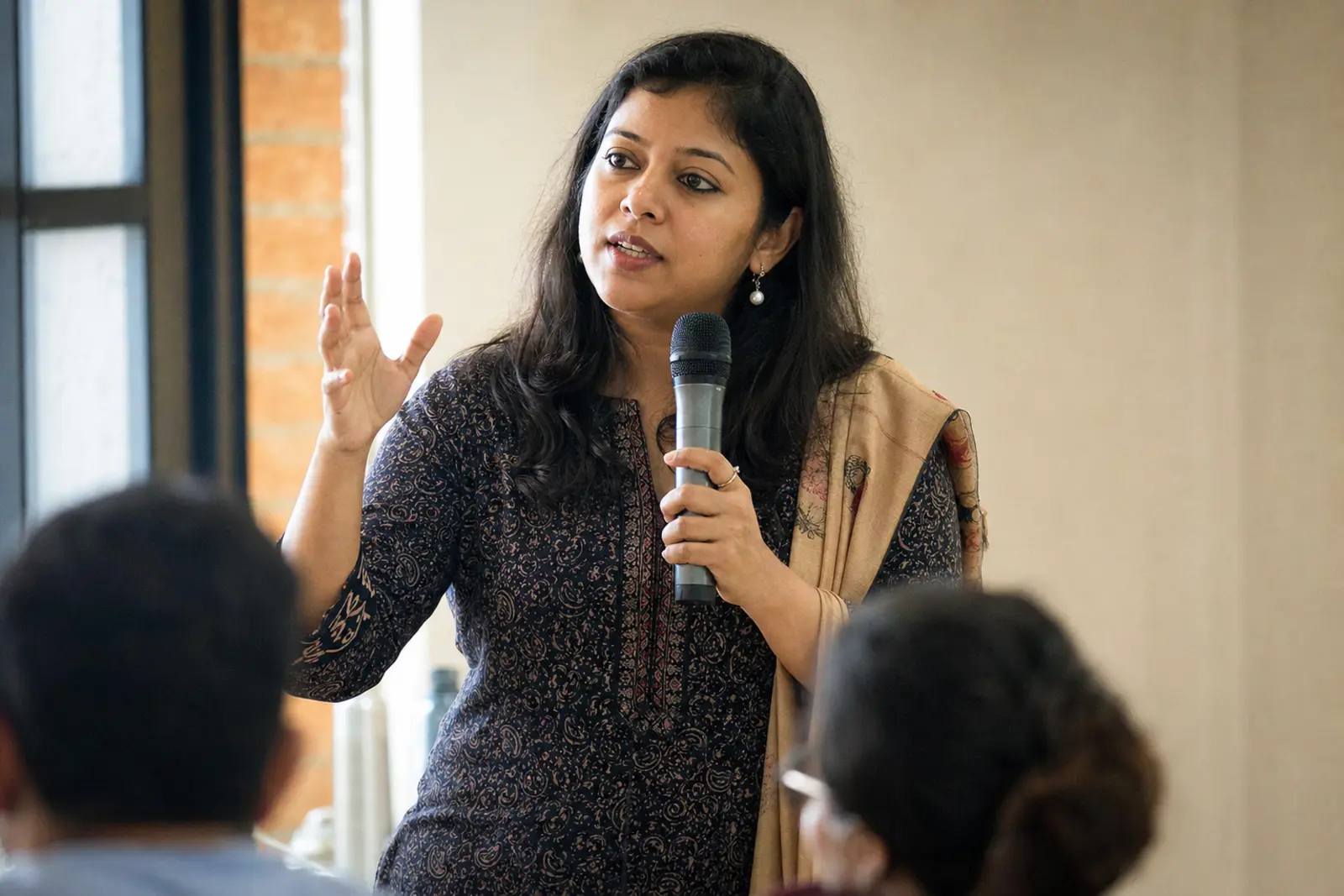 A Bangladeshi woman innovator presents to peers.