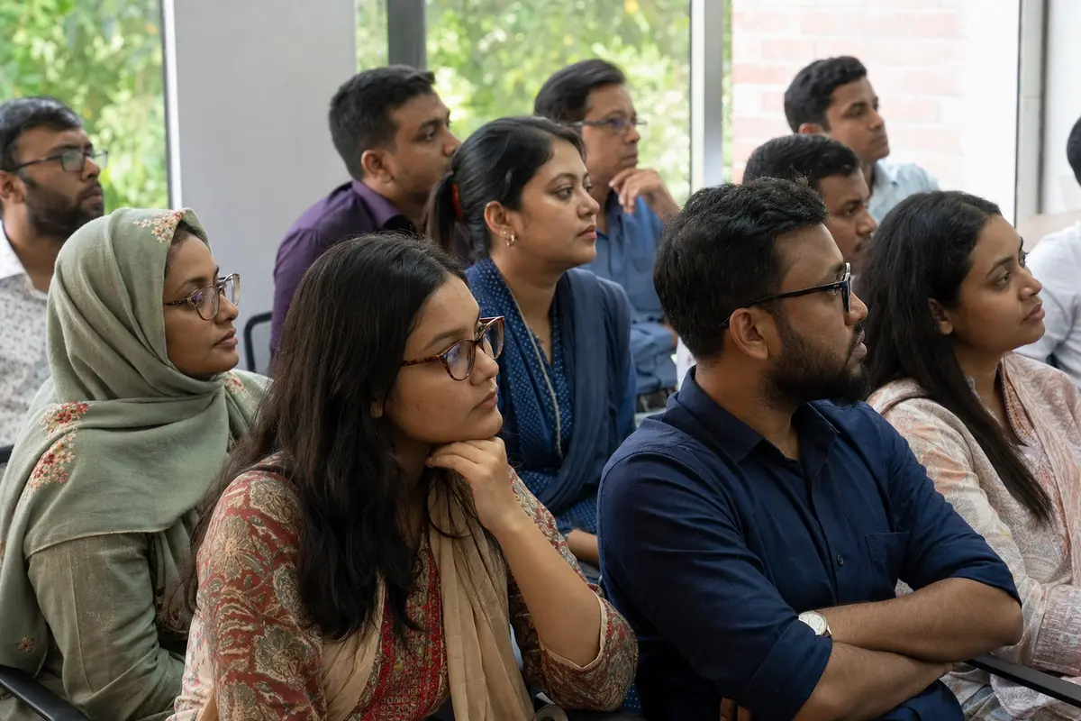 Bangladeshi practitioners listening during a working session.